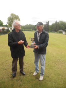 Tournament Manager, Tony O'Donnell presenting Peter Parkinson with the trophy.